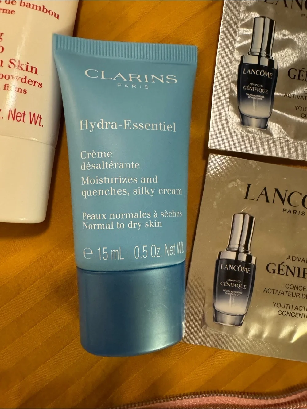 Clarins Pouch with Clarins and other product samples